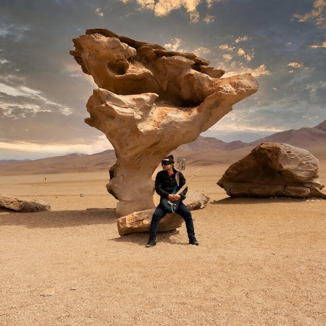 Everton Vidal Azevedo with his palazzolo guitar at the Stone Tree Rock formation in Bolivia. Photo by Marvin Montes